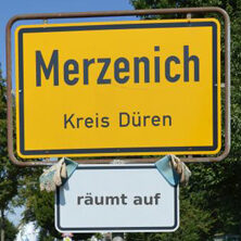 Ortsschild Merzenich + Anhang "räumt auf"